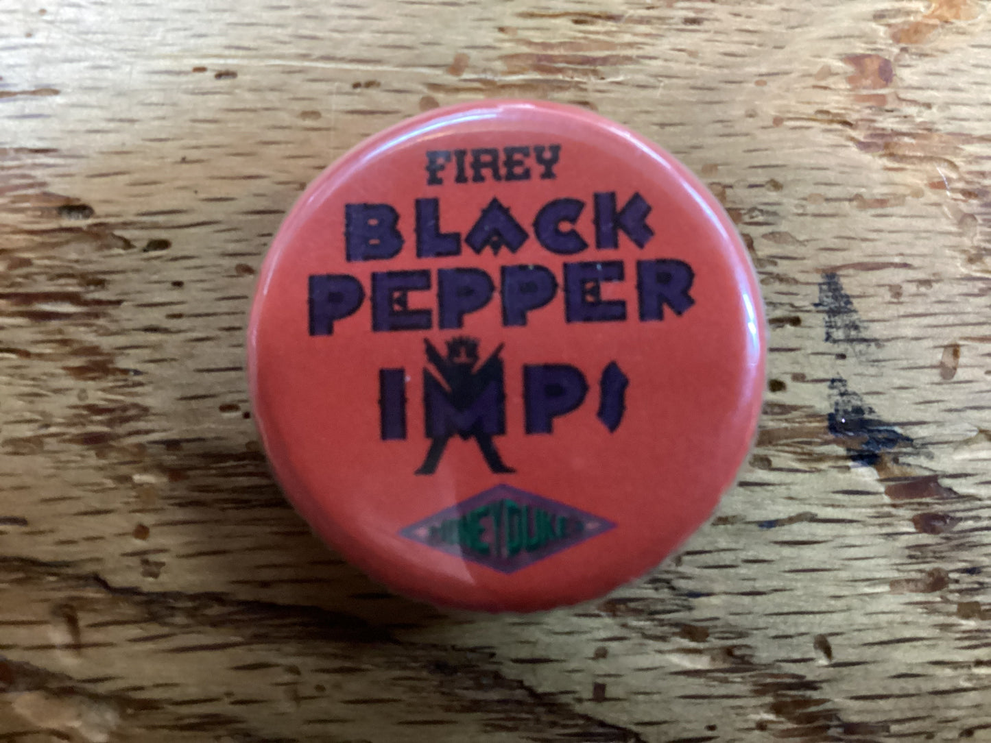 Firey black pepper imps 1.25" button